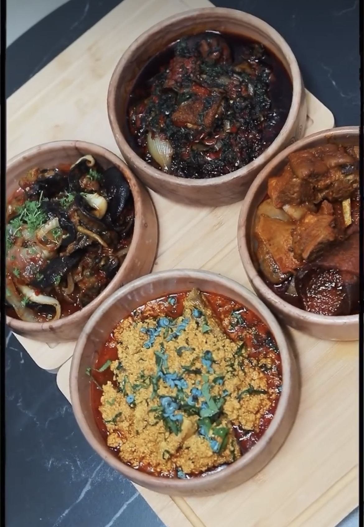 Traditional African swallow with assorted soup and vegetables